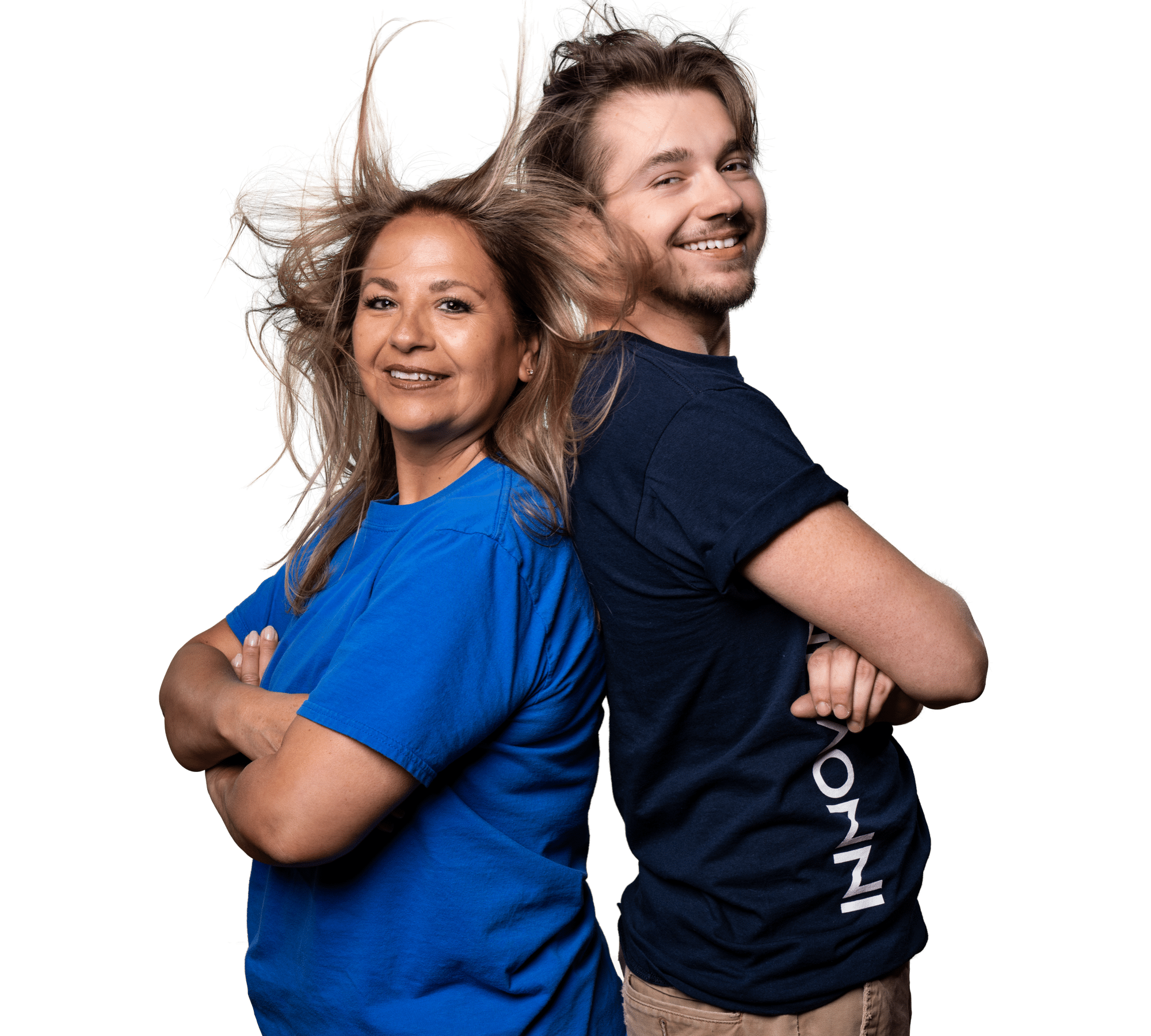 Two Innovair Solutions employees standing back to back with arms crossed, their hair lifted by a gust of air